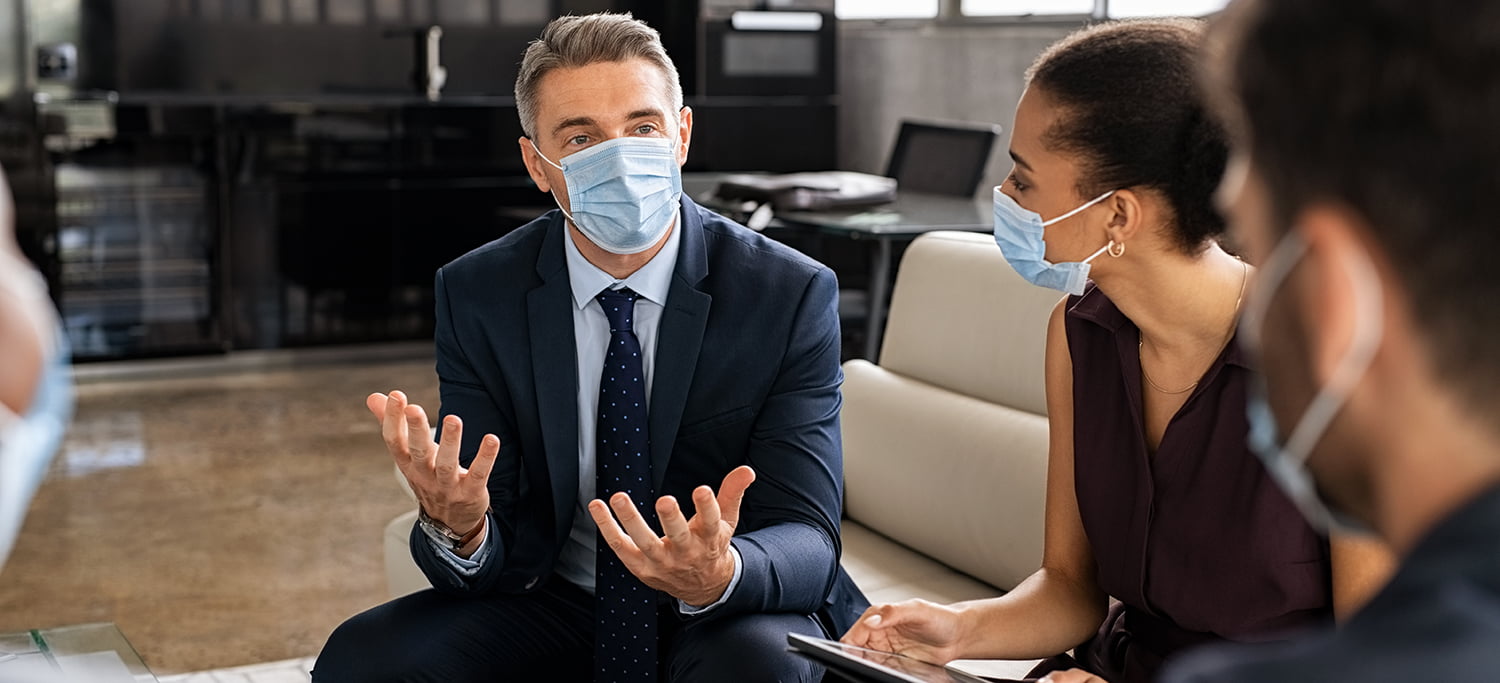 Business leaders with masks