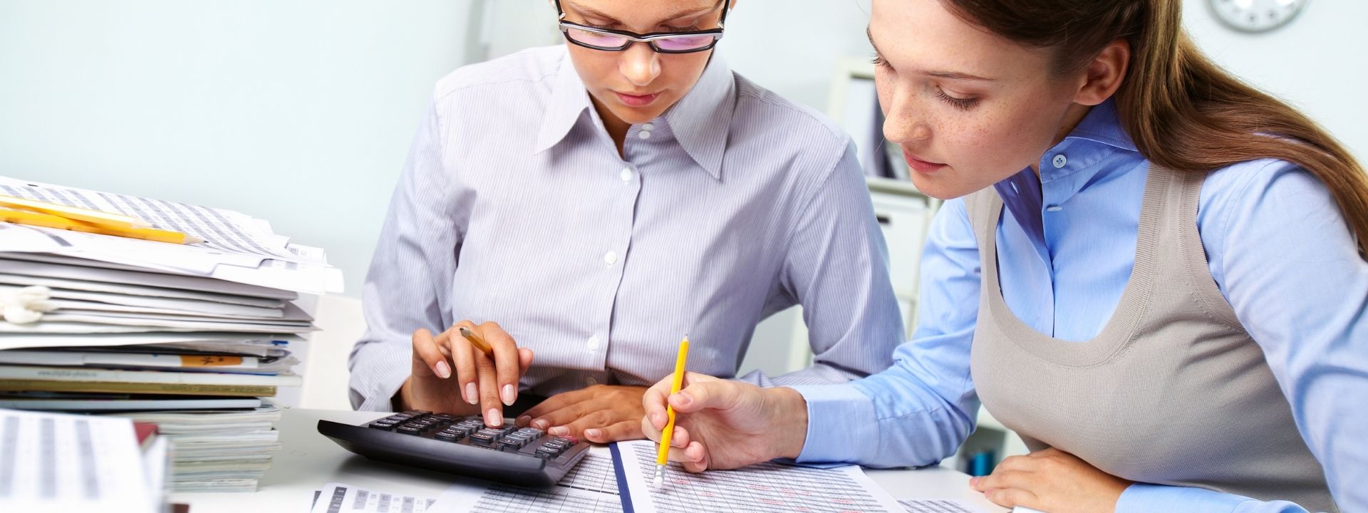 Accountants performing due diligence checklist for M&A